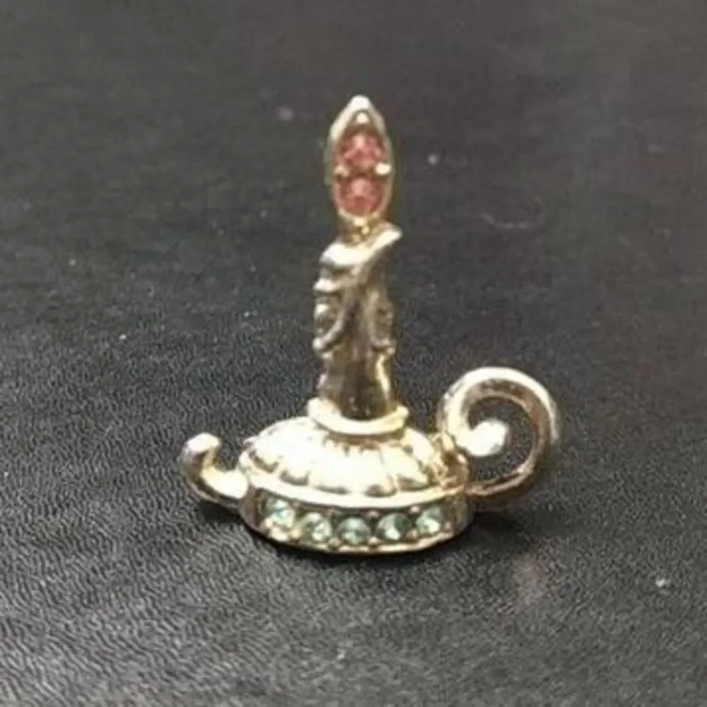 Vintage gold tone candle brooch